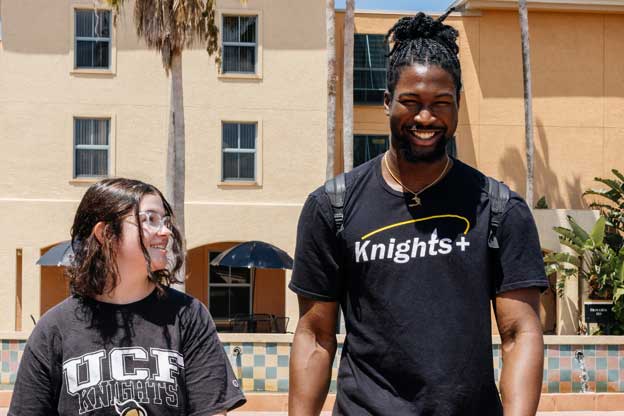 Two students walking on campus